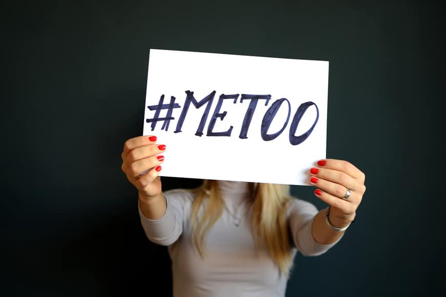 Woman holding up a “#metoo” sign